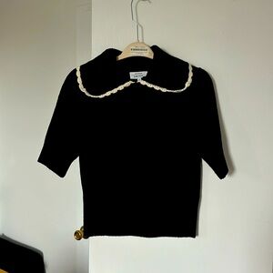 Black knitted sweater with white scalloped detail
Size medium 
Like new